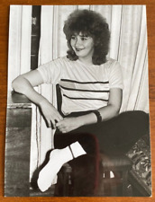 Beautiful girl in white socks on a chair. Vintage photo picture