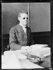 Mr. McWilliams, blind barrister, sitting at his desk with a book, - Old Photo picture