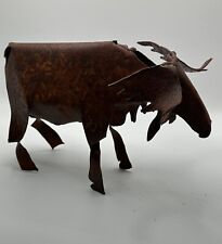Metal moose figurine complete with a beautiful rust patina. Full of character picture