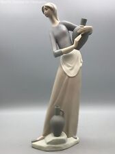 Blue/Cream Lladro Woman Figurine. 1985 The Jug Carrier collection. #4875 picture