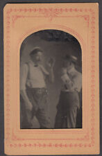 Two men gesturing straw hat suspenders matted tintype ca 1860s picture