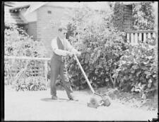 Mr. McWilliams, a blind barrister, mowing the lawns at his home at - Old Photo picture