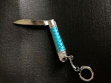 Stunning pocketknife irridescent turquoise color, 5-1/2