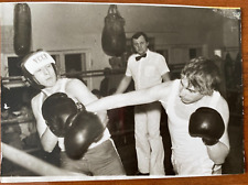 Beautiful guys boxing in competitions. Vintage photo picture