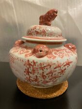 Very fine pink color porcelain pot with flowers and foo dog on the lid.  picture