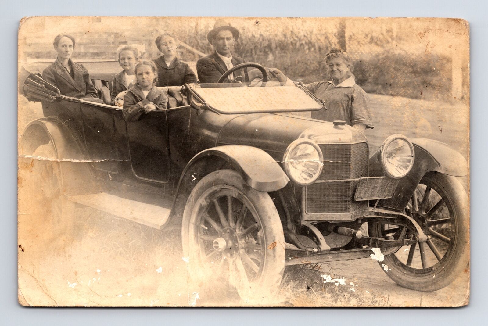 RPPC Family Three Kids in 1920s Touring Car Greet a Woman Real Photo Postcard