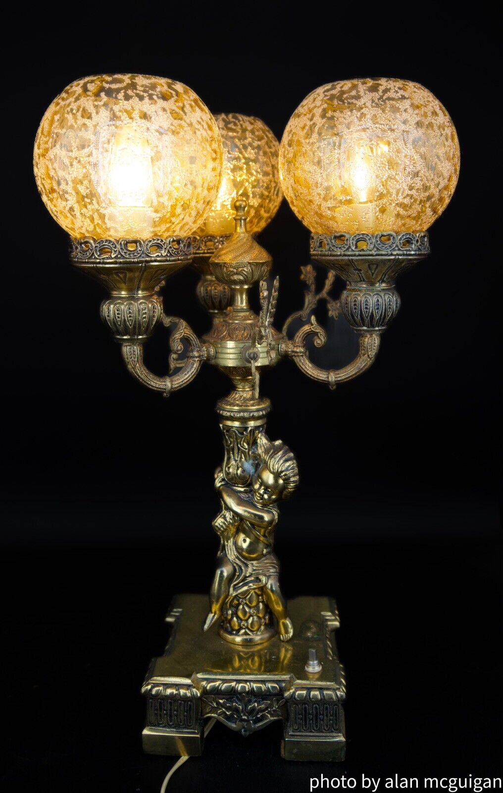 Two Art deco Brass Lamps  3Globes  Approx. 22” Tall 16” Across.  Cherub On One