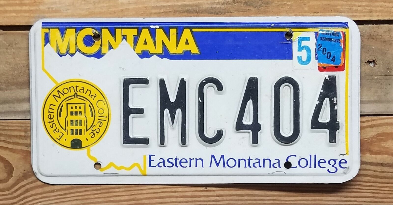 Montana expired 2004 Eastern Montana College License Plate - EMC404 ~ Embossed