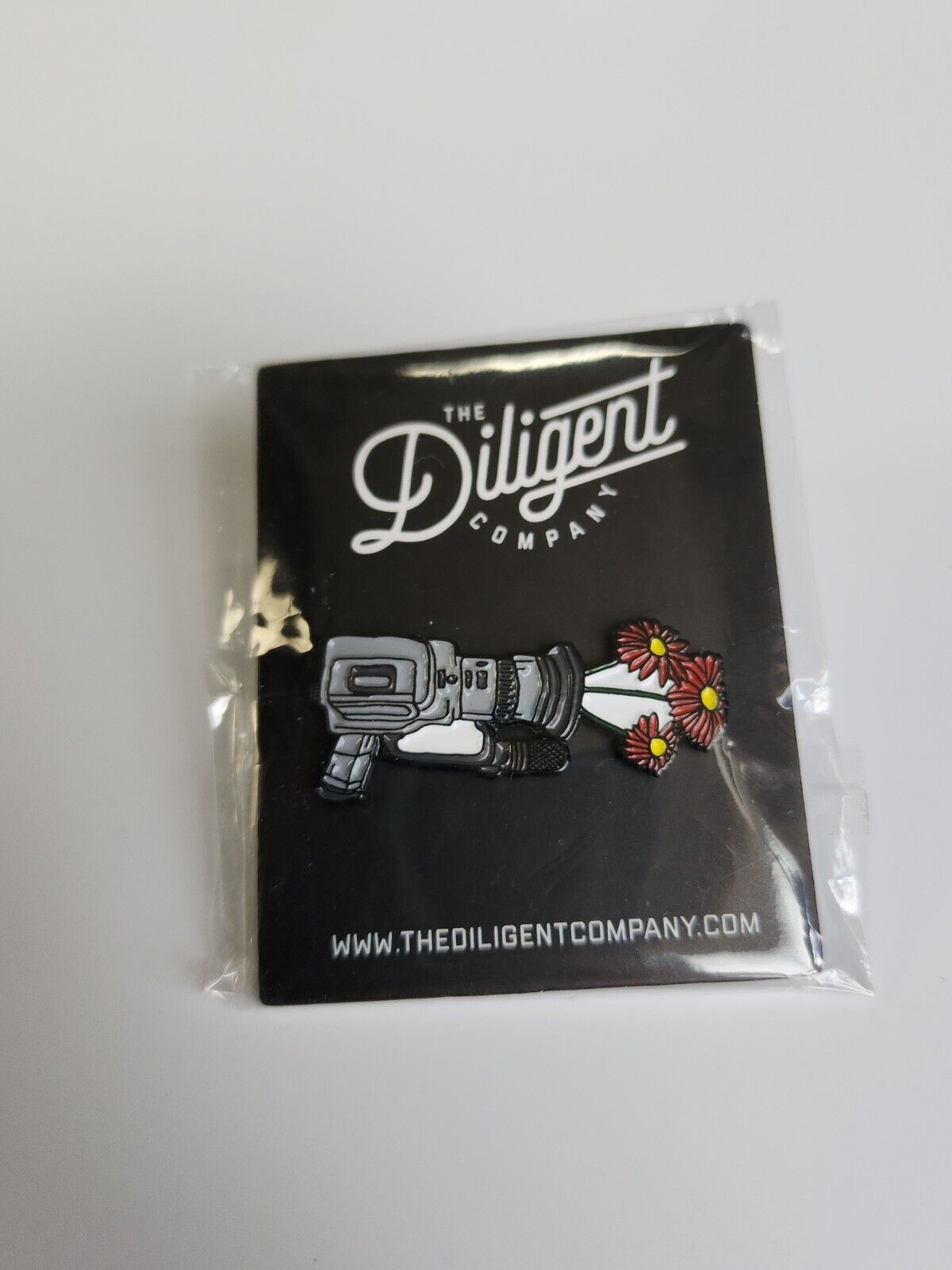 Video Camera Shooting Flowers Lapel Pin The Diligent Company Video Production Co