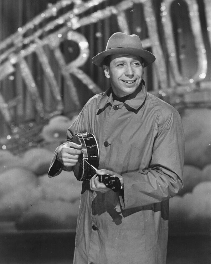 George Formby 24x36 inch Poster in raincoat playing ukelele
