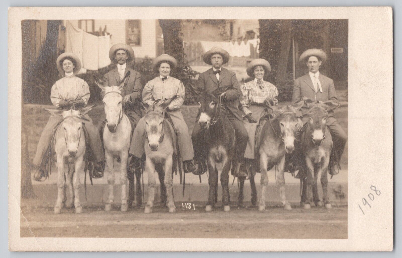 RPPC 1908 Postcard Couples Posing On Donkeys Wearing Hats Near Hotel or Resort