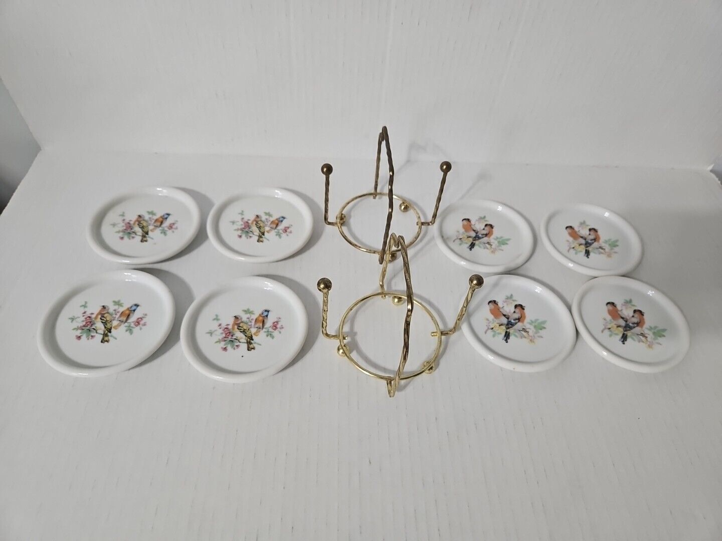Vintage INTERPUR Porcelain Coasters Brass Holder Set of 8 Bird Plates 3.5 inch