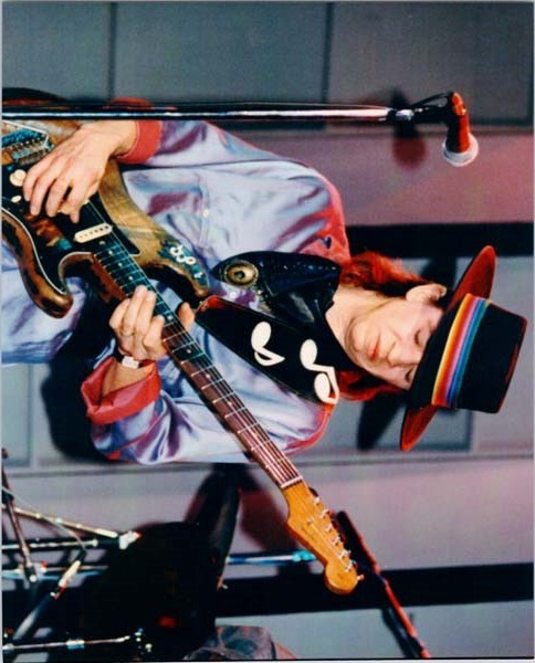 Stevie Ray Vaughan in concert 8x10 inch press photo Stevie playing guitar