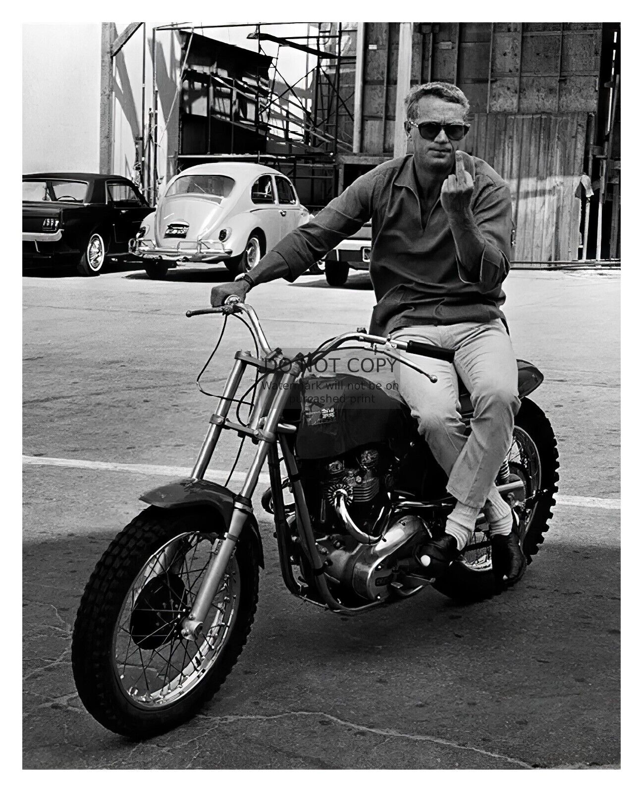 STEVE MCQUEEN FLIPPING THE BIRD ON MOTORCYCLE 8X10 B&W PHOTO