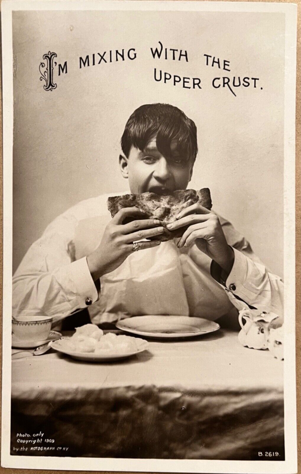 RPPC Young Man Eating Pizza Bread Humorous Antique Real Photo Postcard c1910
