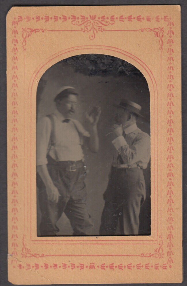 Two men gesturing straw hat suspenders matted tintype ca 1860s