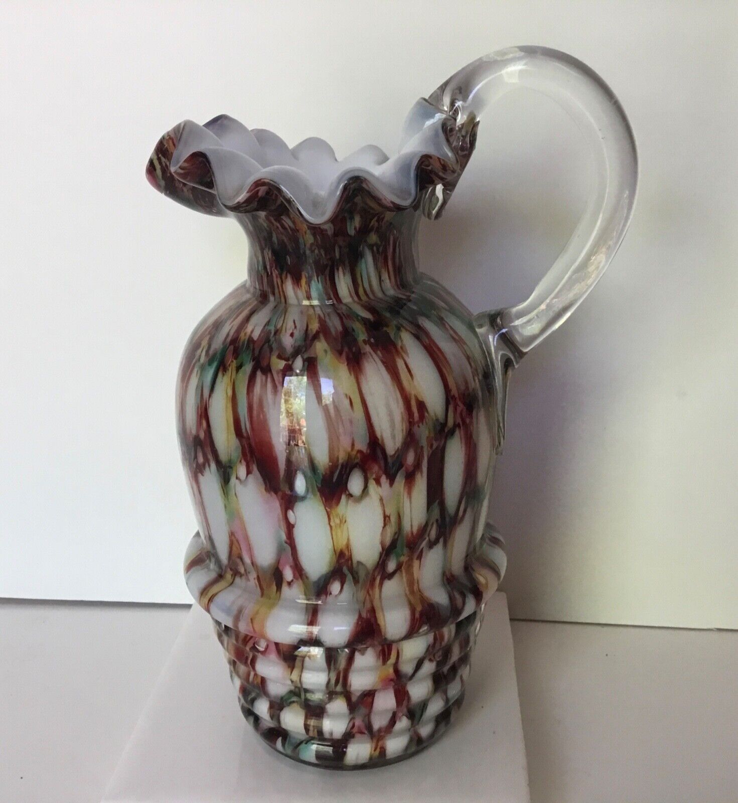 Murano multi-colored with frosted glass ewer with clear glass handle.