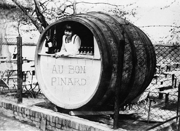 Young woman in her barrel-shaped booth in 1930 Old Historic Photo 1