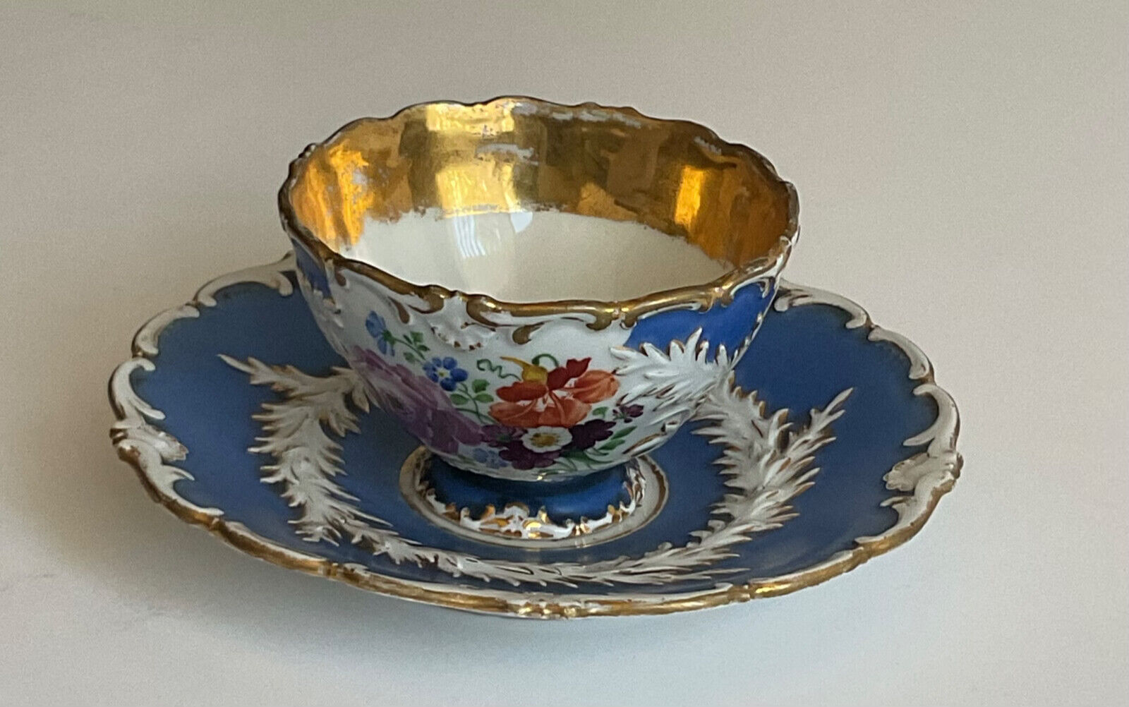 antique meissen blue and white with gold floral teacup and saucer 1925