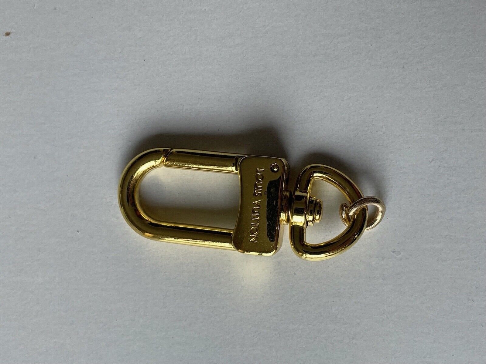 One LOUIS VUITTON LV Logo Carabiner Metal Gold tone zipper pull Charm 47 x 28 mm