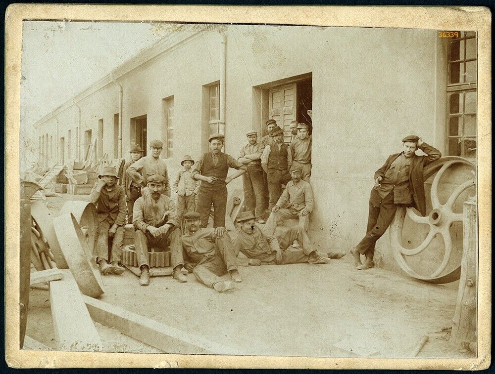 workers, mechanics in a factory, occupation, profession, unusual, antique Cabine