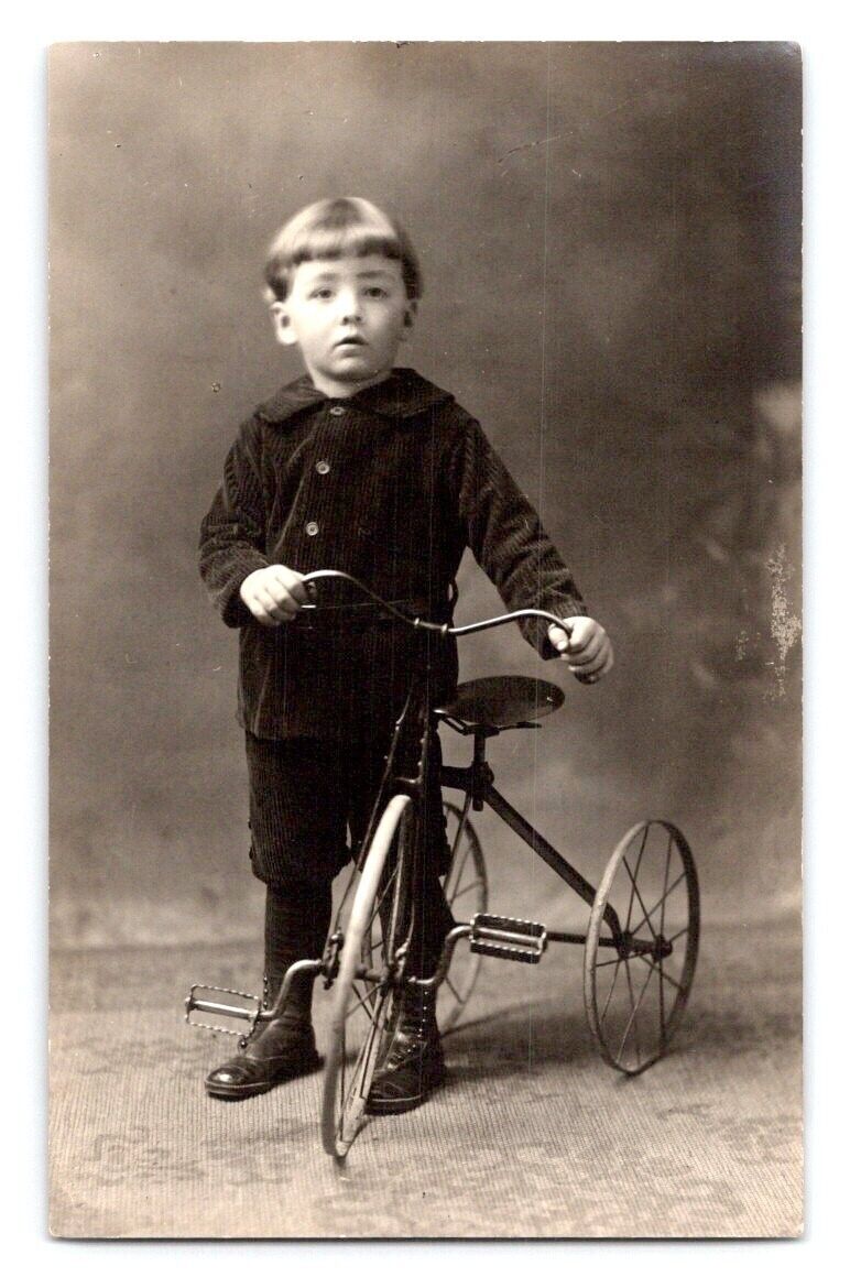 RPPC 1910. BOY POSING WITH ANTIQUE TRICYCLE. POSTCARD. SS28