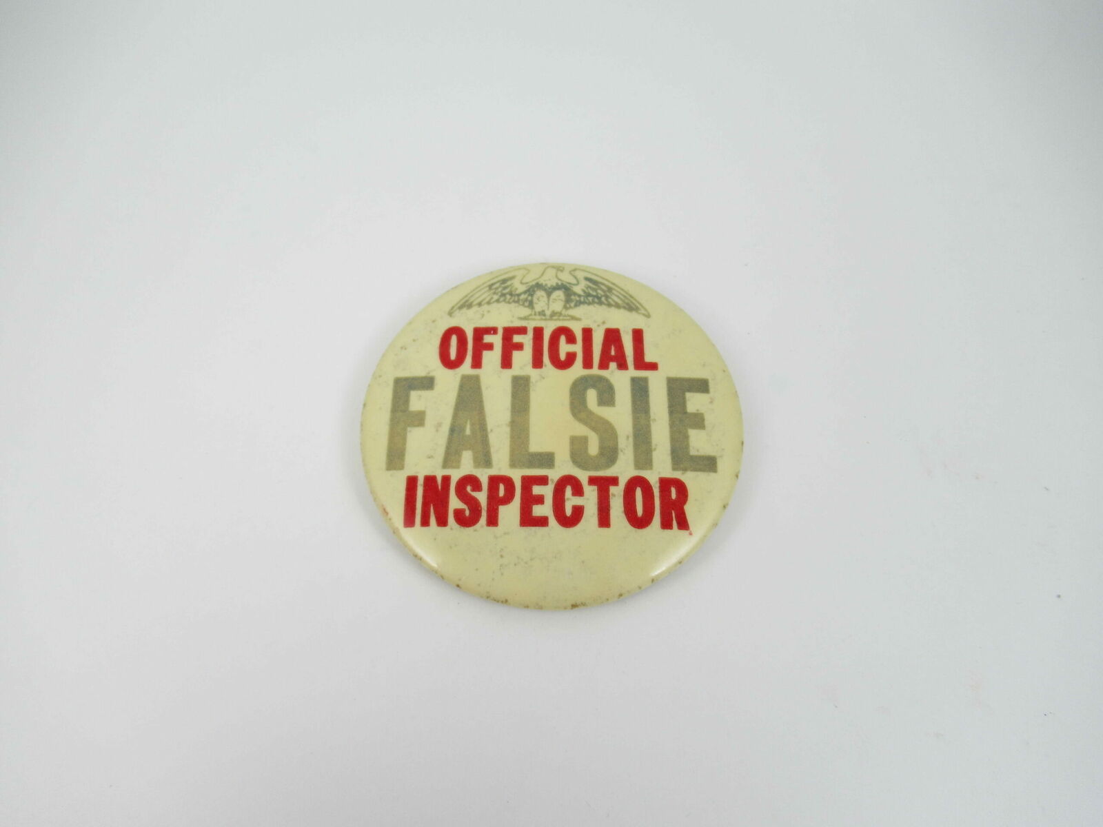 VINTAGE OFFICIAL FALSIE INSPECTOR 1960’S HUMOROUS PIN-BACK BUTTON GOOD USED 