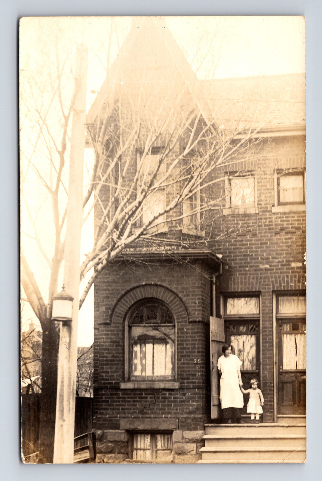 RPPC Mother & Small Girl on Porch of Large Brick Two Story Urban Home Postcard