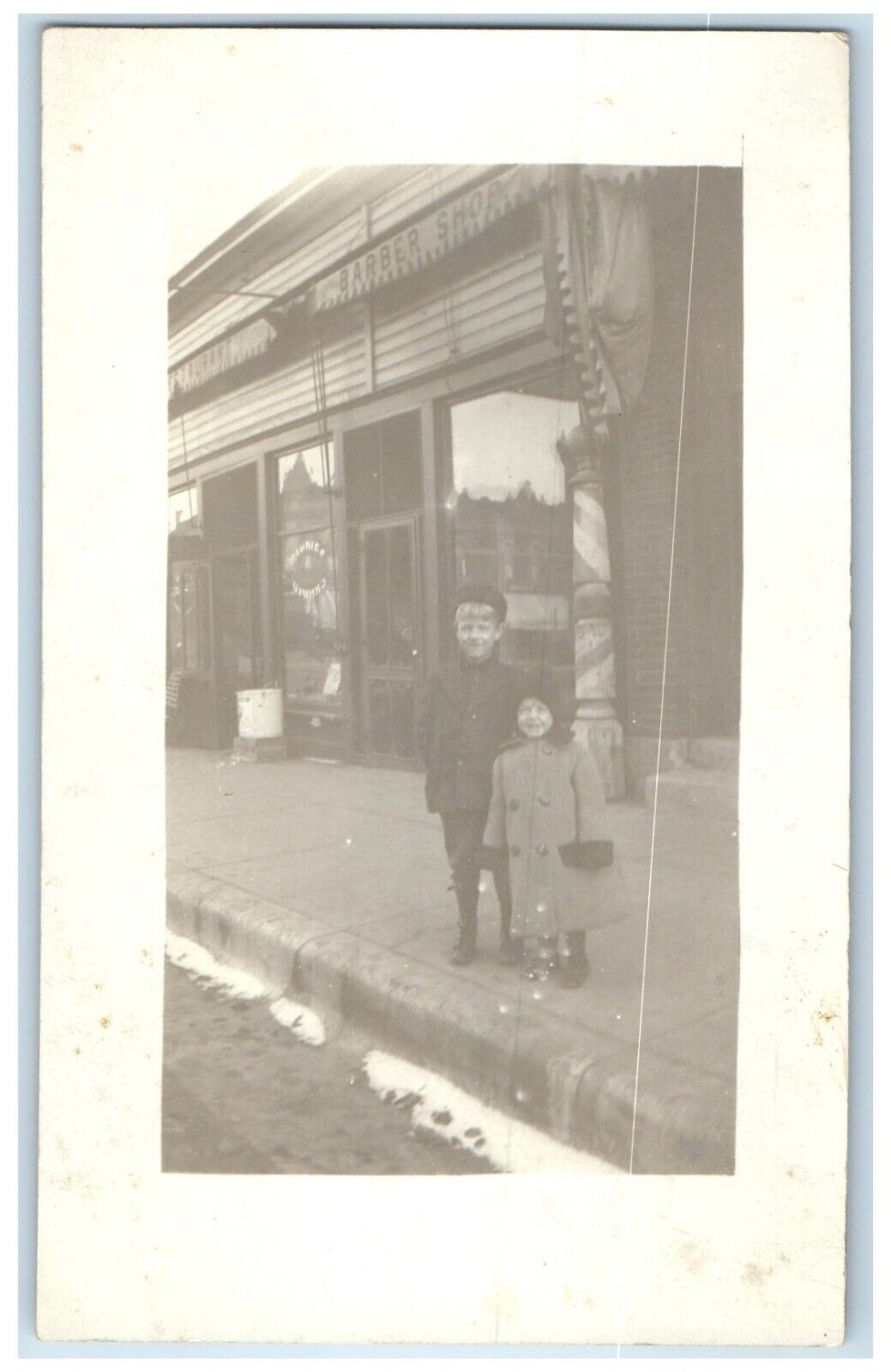 Lansing Iowa IA Postcard RPPC Photo Children In Front Of Barber Shop c1910's