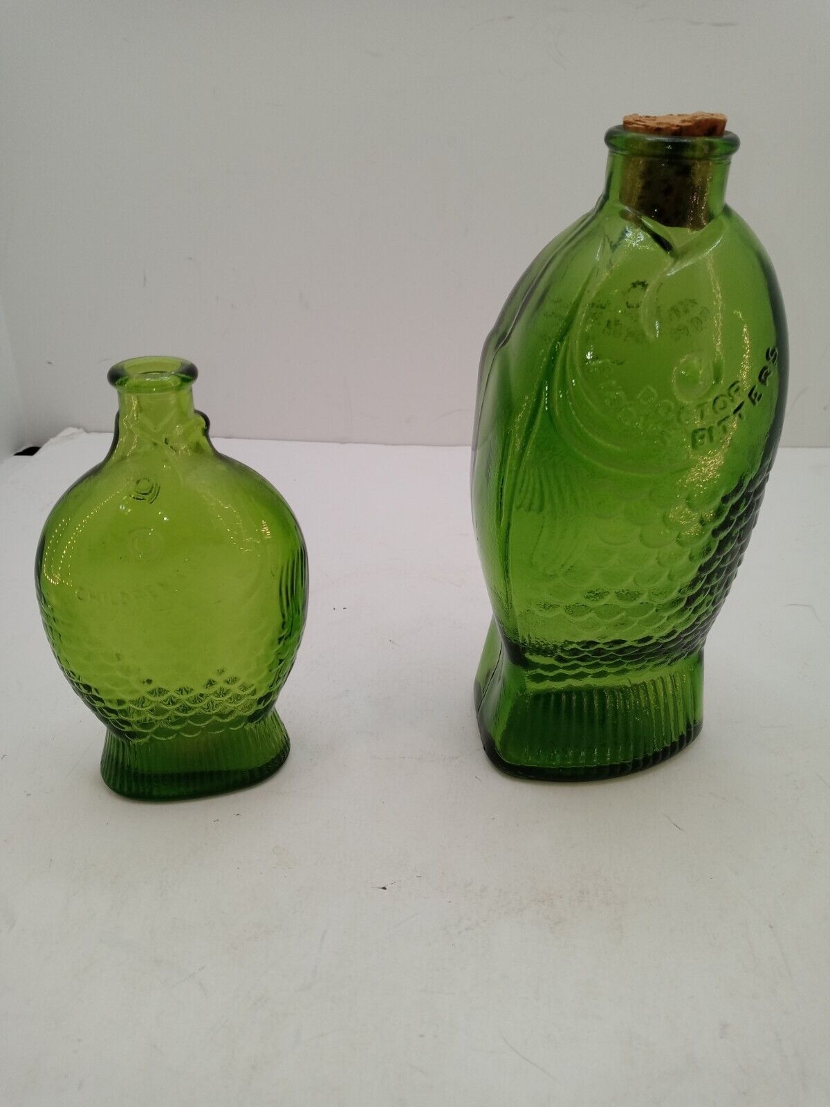 2 Vintage DR. FISCH\'S BITTERS Green Glass Fish Bottles 7.25\